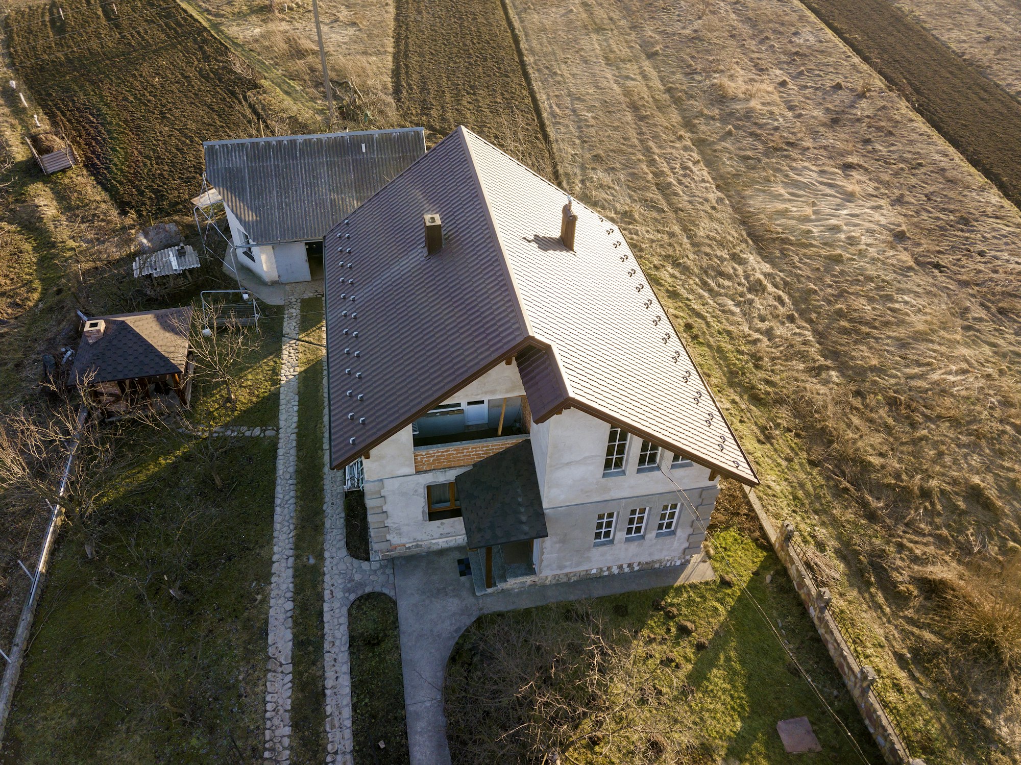 Aerial view of new residential house cottage with shingle roof