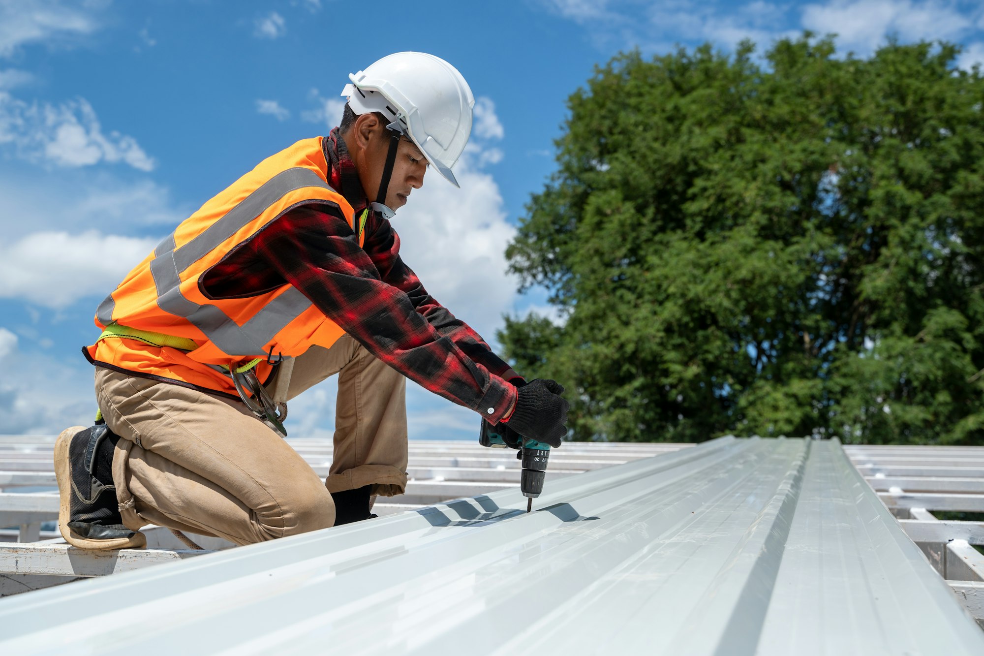 The Roofer technicians work and installing new roof structure on top roof of house.